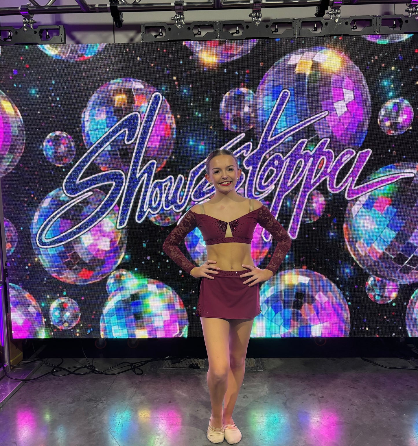 Girl in a red two piece dance costume